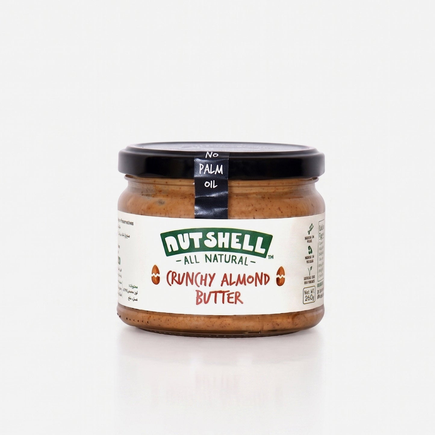 A jar of Butshell Crunchy Almond Butter on a clean white background. The jar has a black lid and a white label with green and red text.